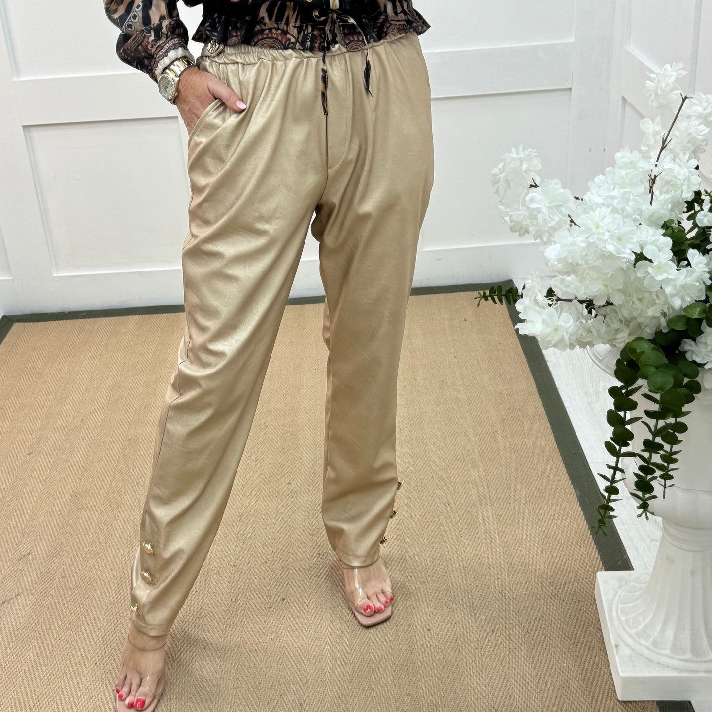 Tatum: Gold faux leather button trousers. One size: 14-18
