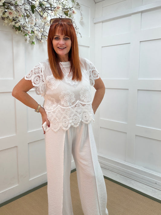 Lula: White embroidered short sleeve top. One size: 10-14