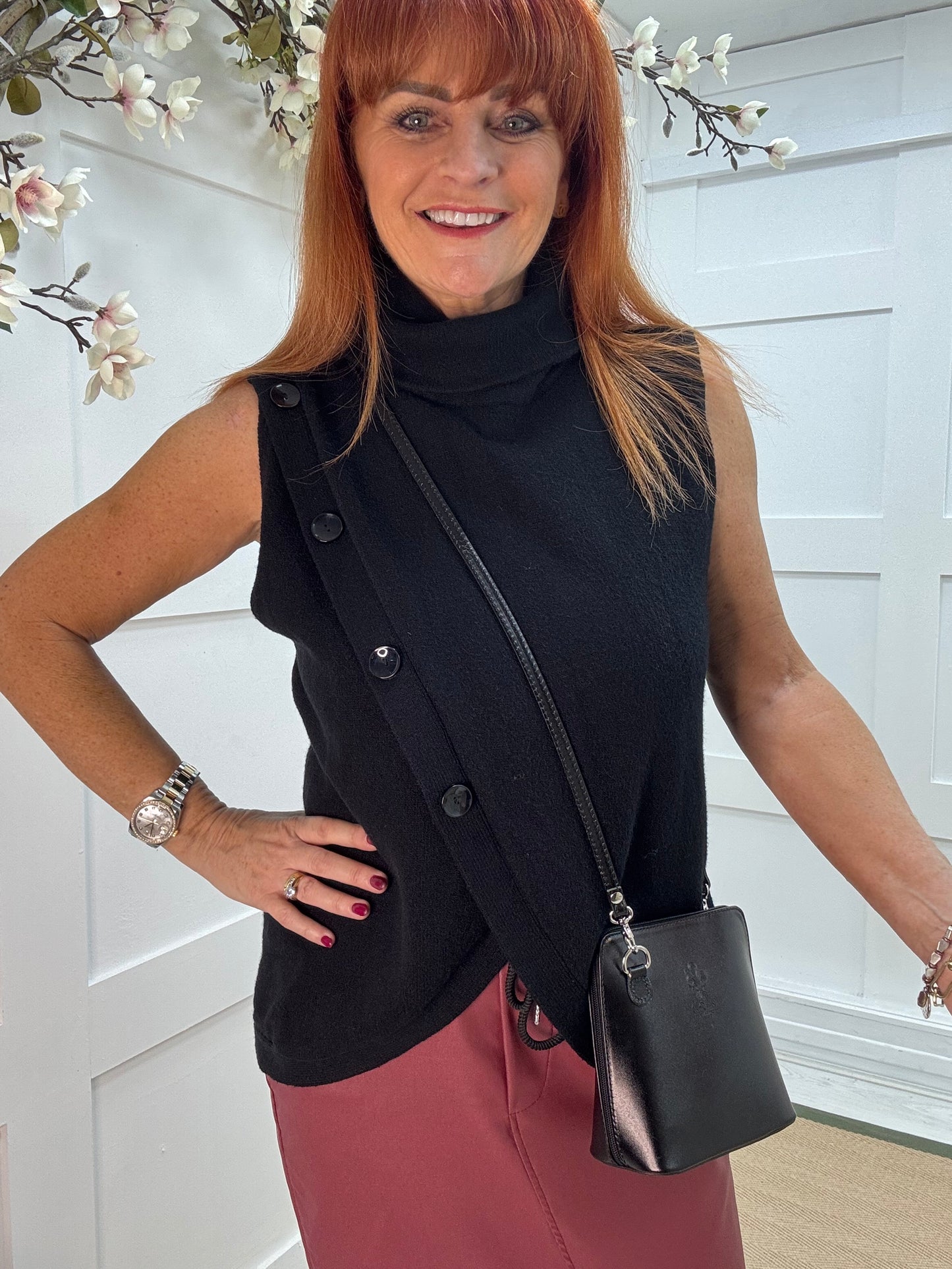 Viola: Black sleeveless cowl neck wrap top. One Sz: 10-16