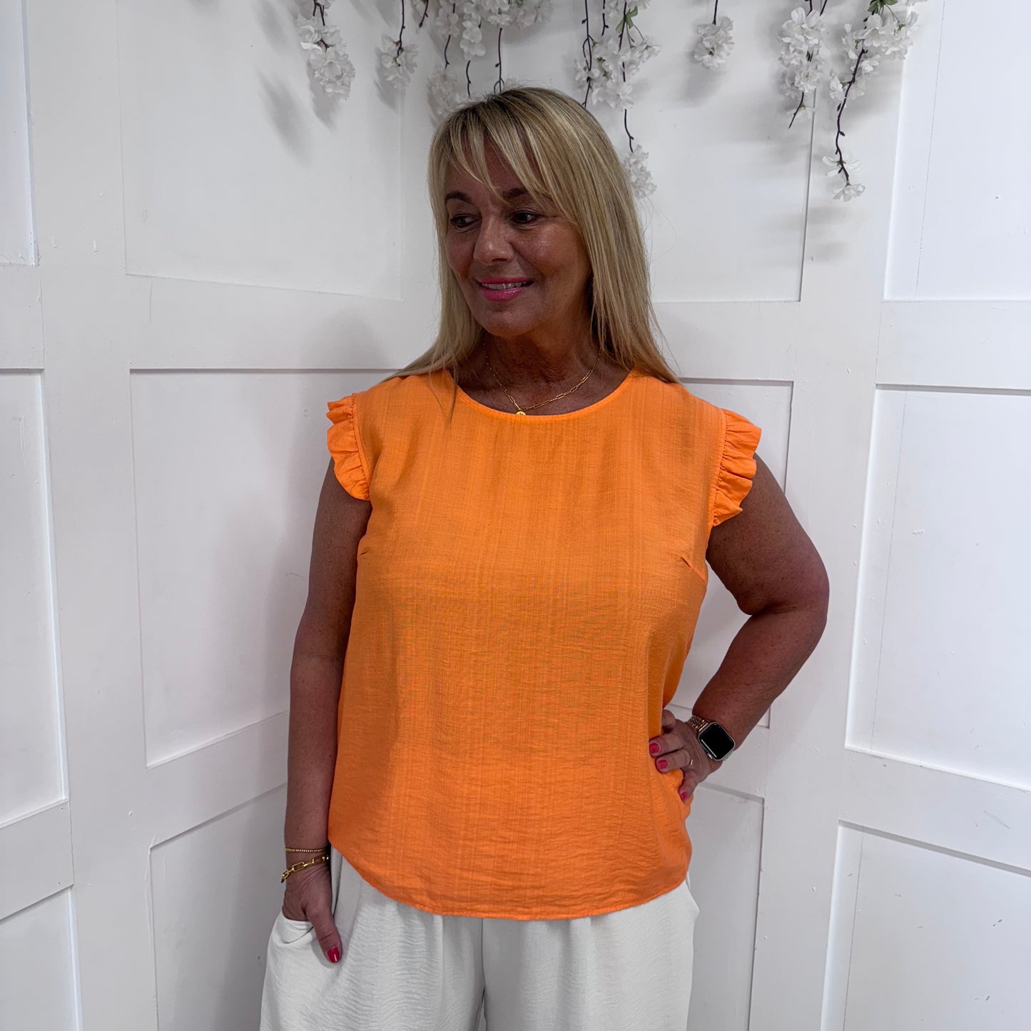 Billie: Orange button back frilled top. One size 14-20