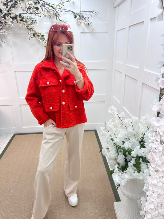 Bridget: Orange short boucle button jacket. One: 12-20