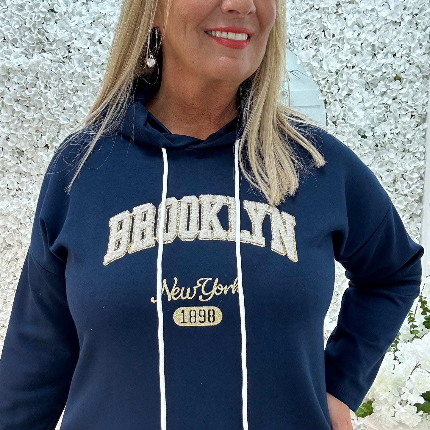 Madison: Navy Brooklyn logo hoodie. One size: 12-18