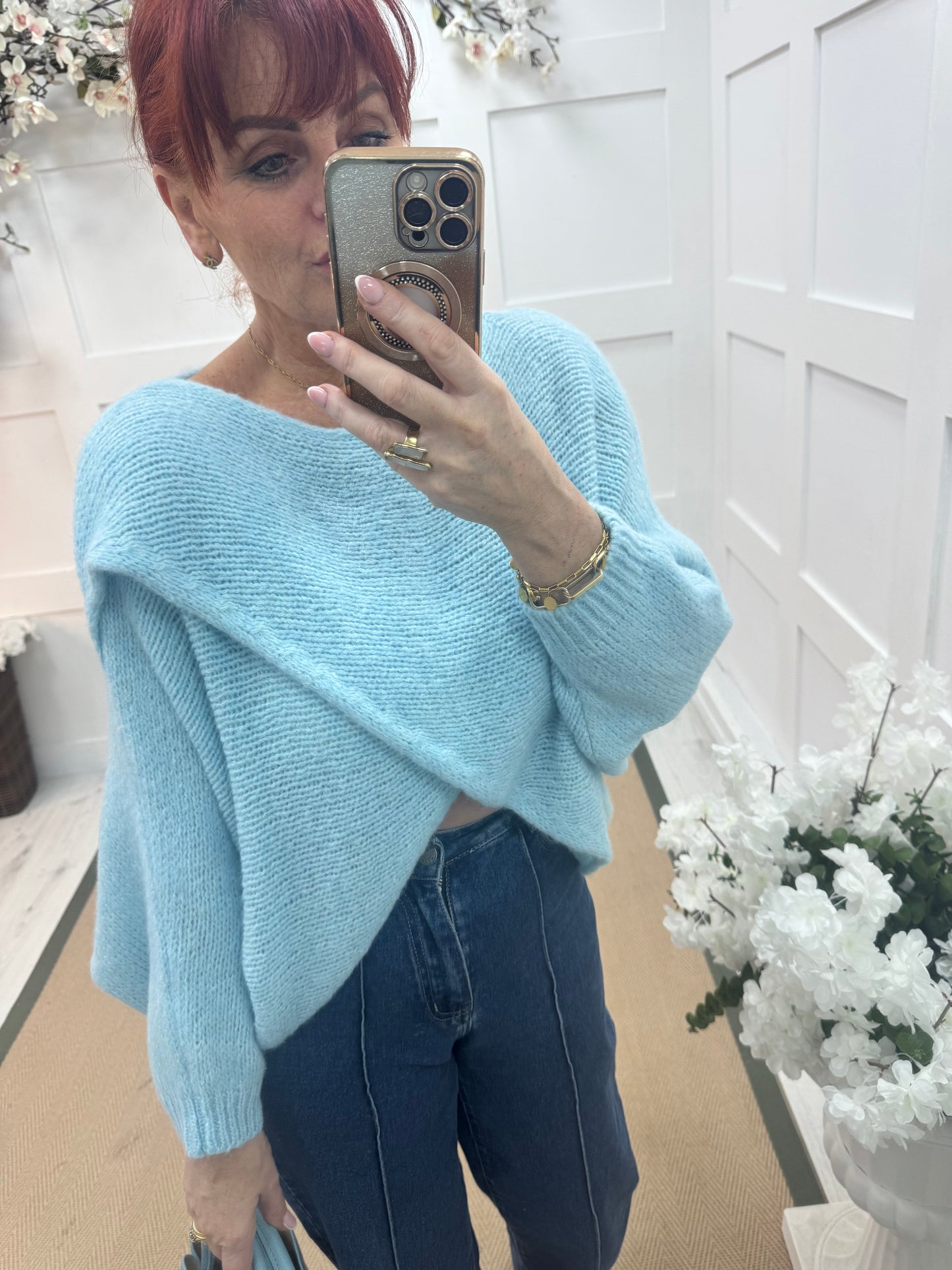 Willow: Light blue stretchy short wrap top. One size: 10-18