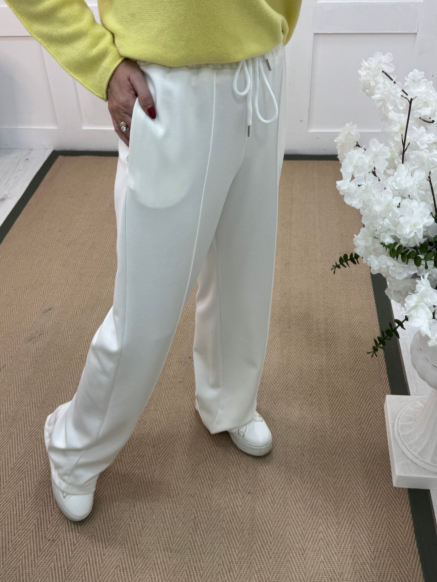 Trudy: White stretchy wide leg pocket trousers. 2 sizes