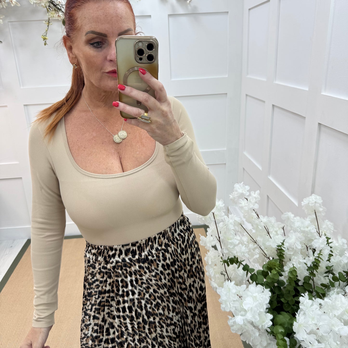 April: Sand stretchy waist cinch bodysuit. 2 sizes