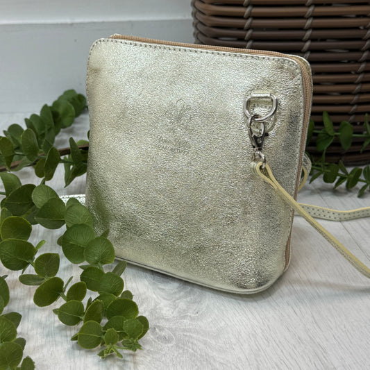 Thea: Gold leather cross body/clutch bag.