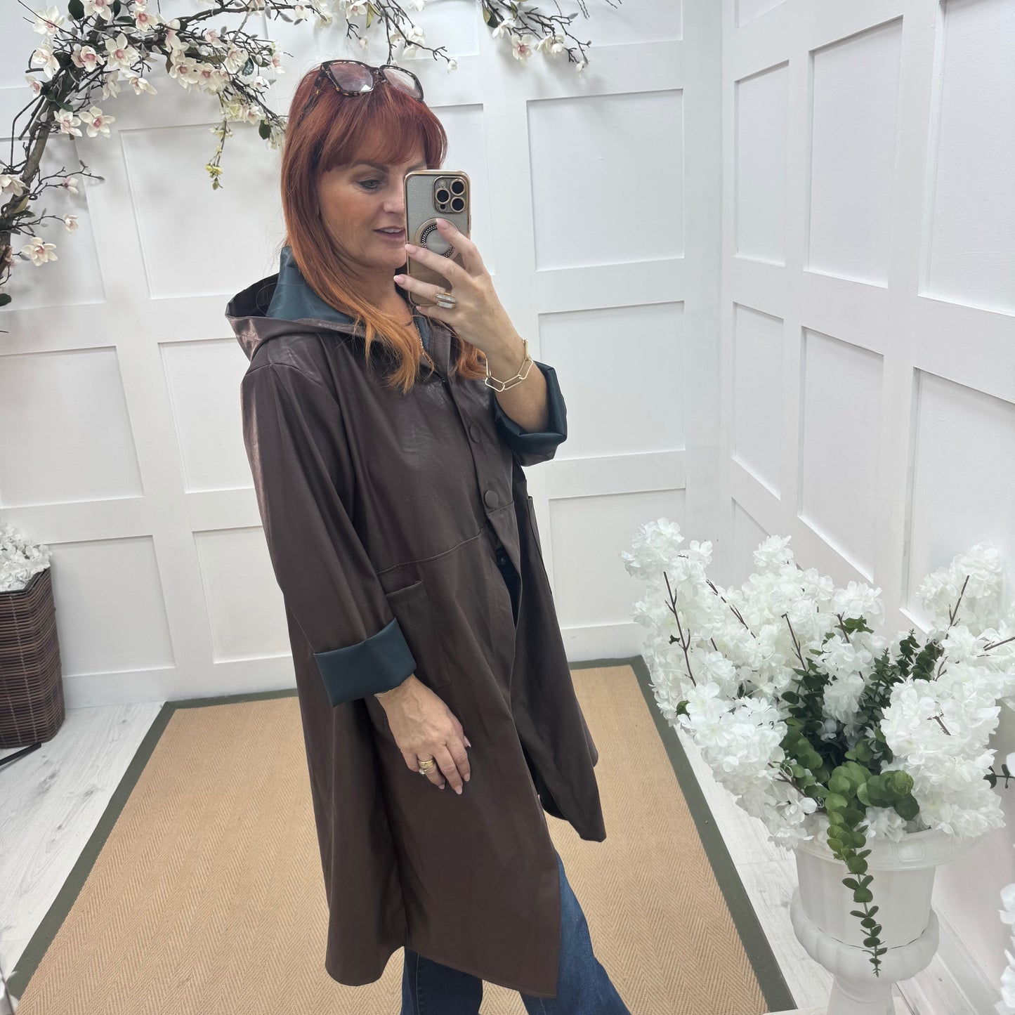 Alma: Brown long hooded raincoat. One size 12-18