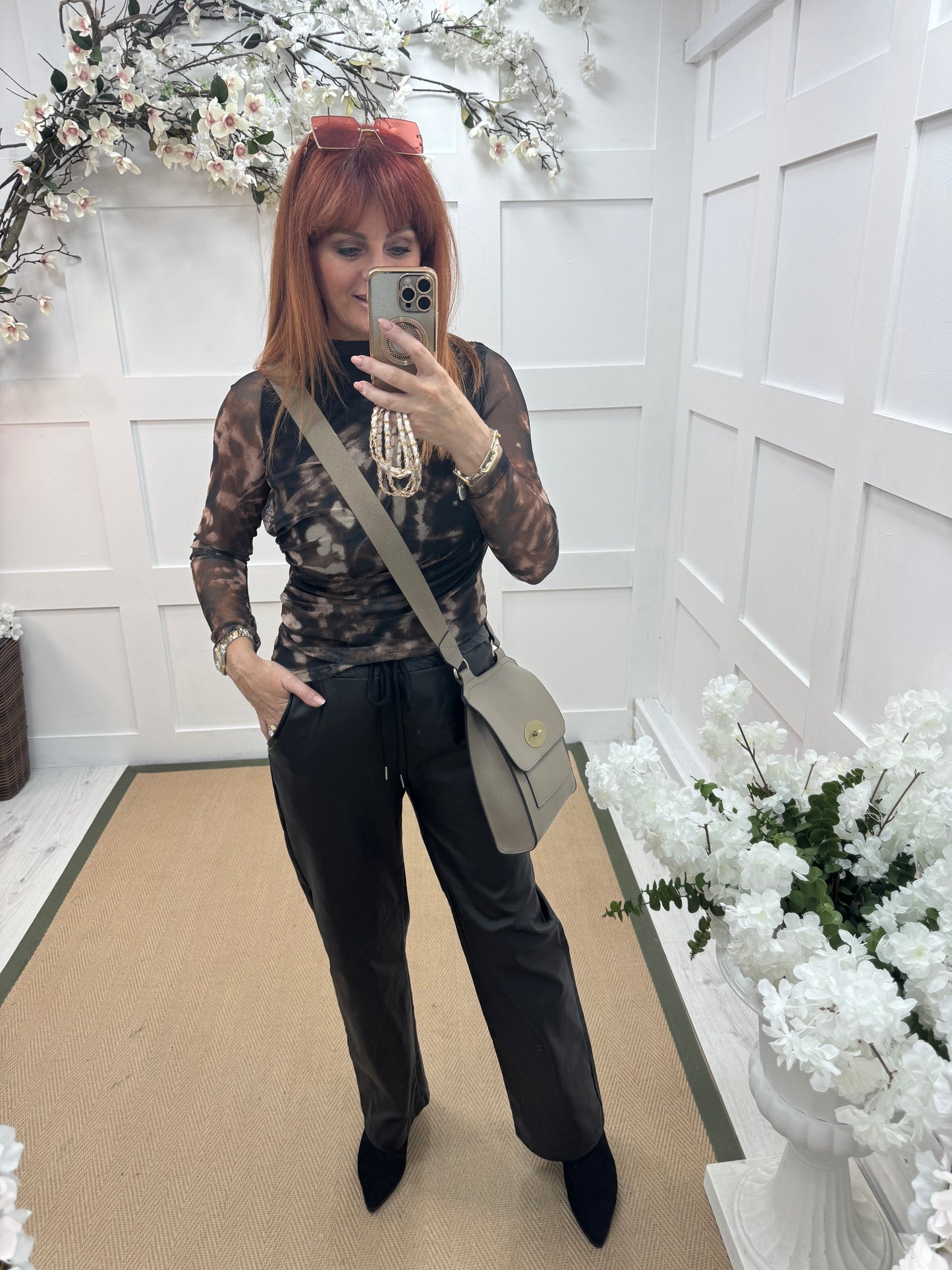 Quinn: Black faux leather trousers. One size: 10-14