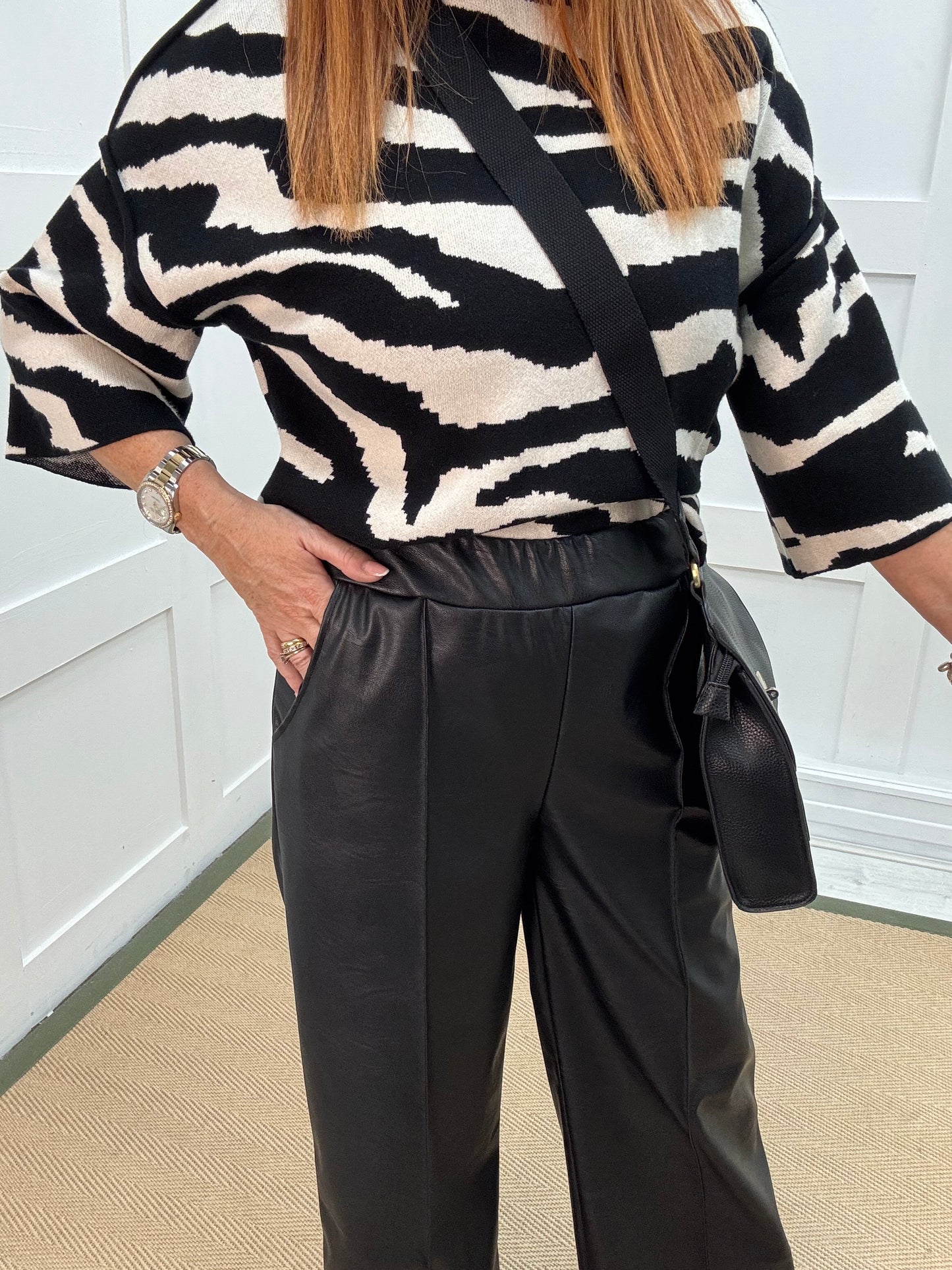 Tabatha: Black faux leather trousers. One size: 12-16