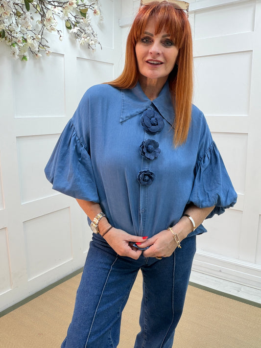 Poppy: Blue collared short sleeved floral shirt. 2 sizes.