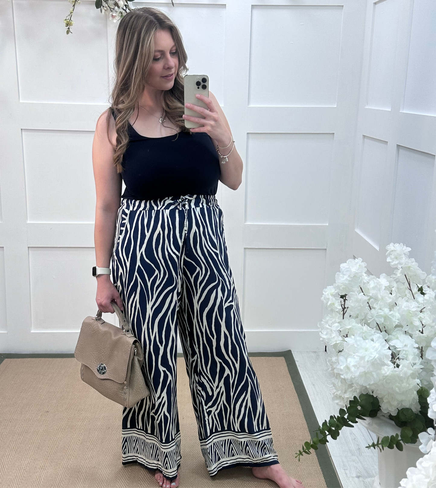 Skye: Navy zebra print wide leg trousers. One size: 10-16