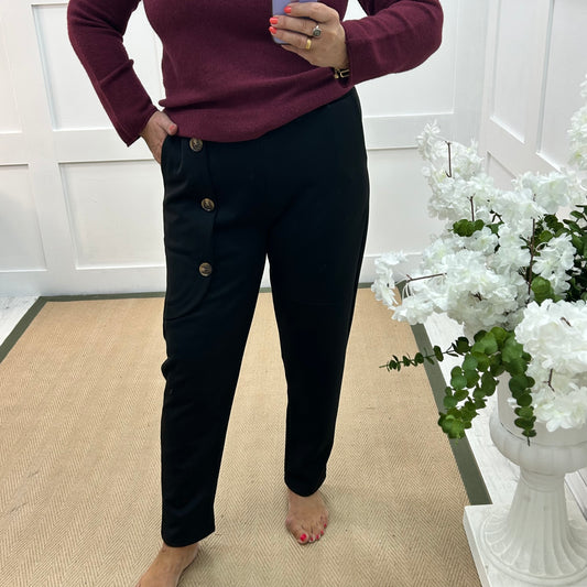 Monroe: Black stretchy button trousers. One size: 12-18