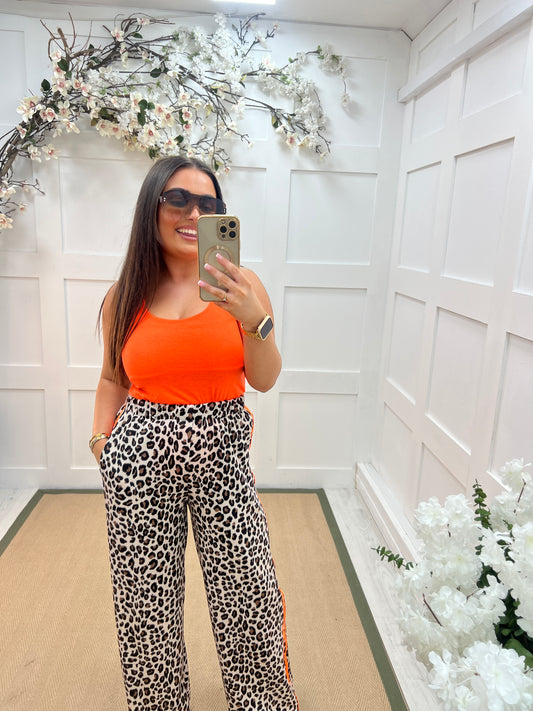 Abigail: Stretchy neon orange basic vest top. 2 sizes