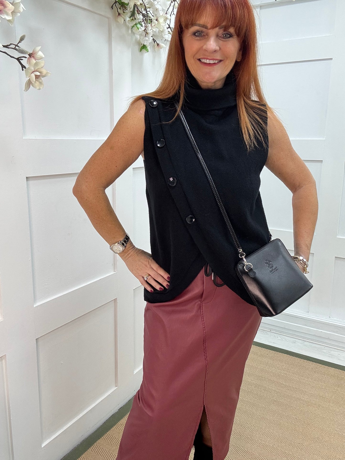 Viola: Black sleeveless cowl neck wrap top. One Sz: 10-16