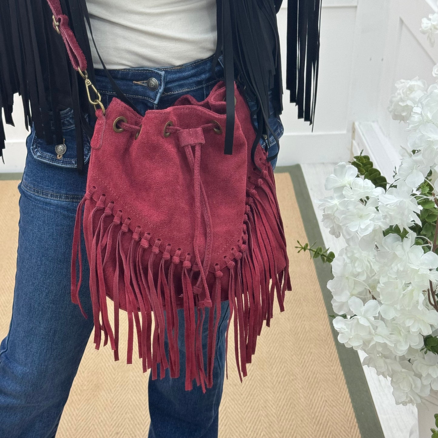 Athena: Burgundy real suede fringe cross body bag.