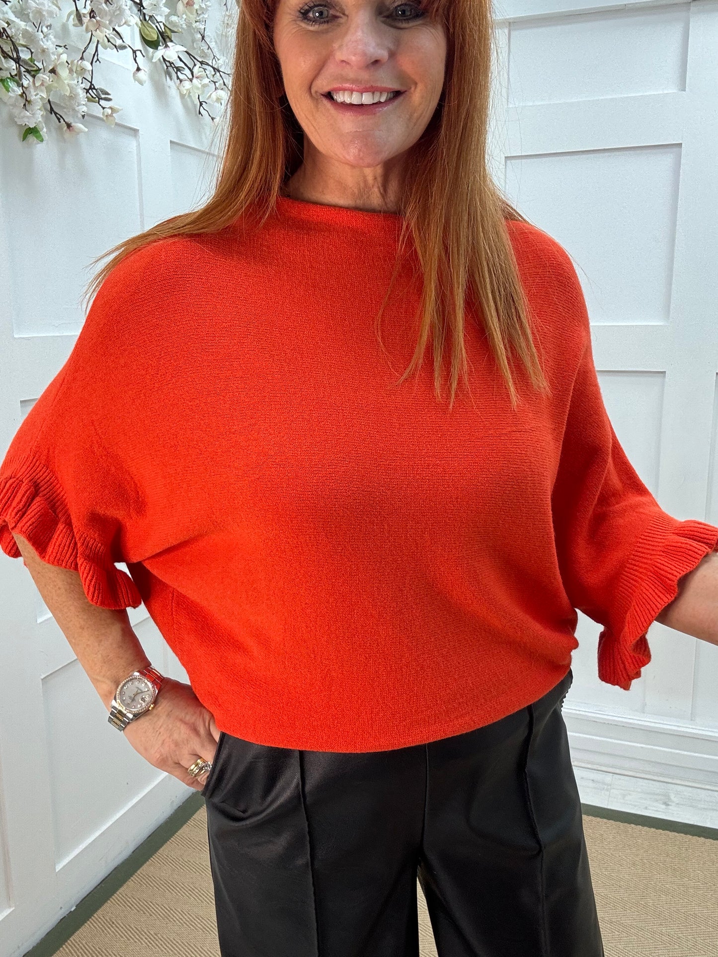 Sierra: Orange batwing fluted sleeve knitted top. One Size 12-18/20