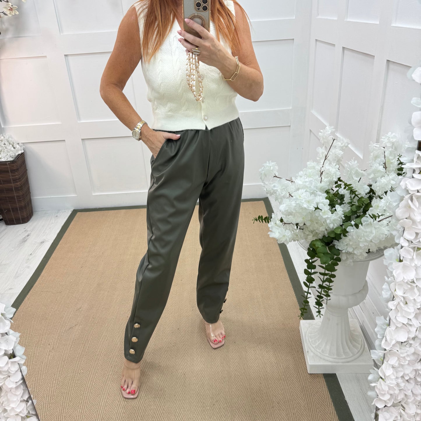 Tatum: Khaki faux leather button trousers. One size: 14-18