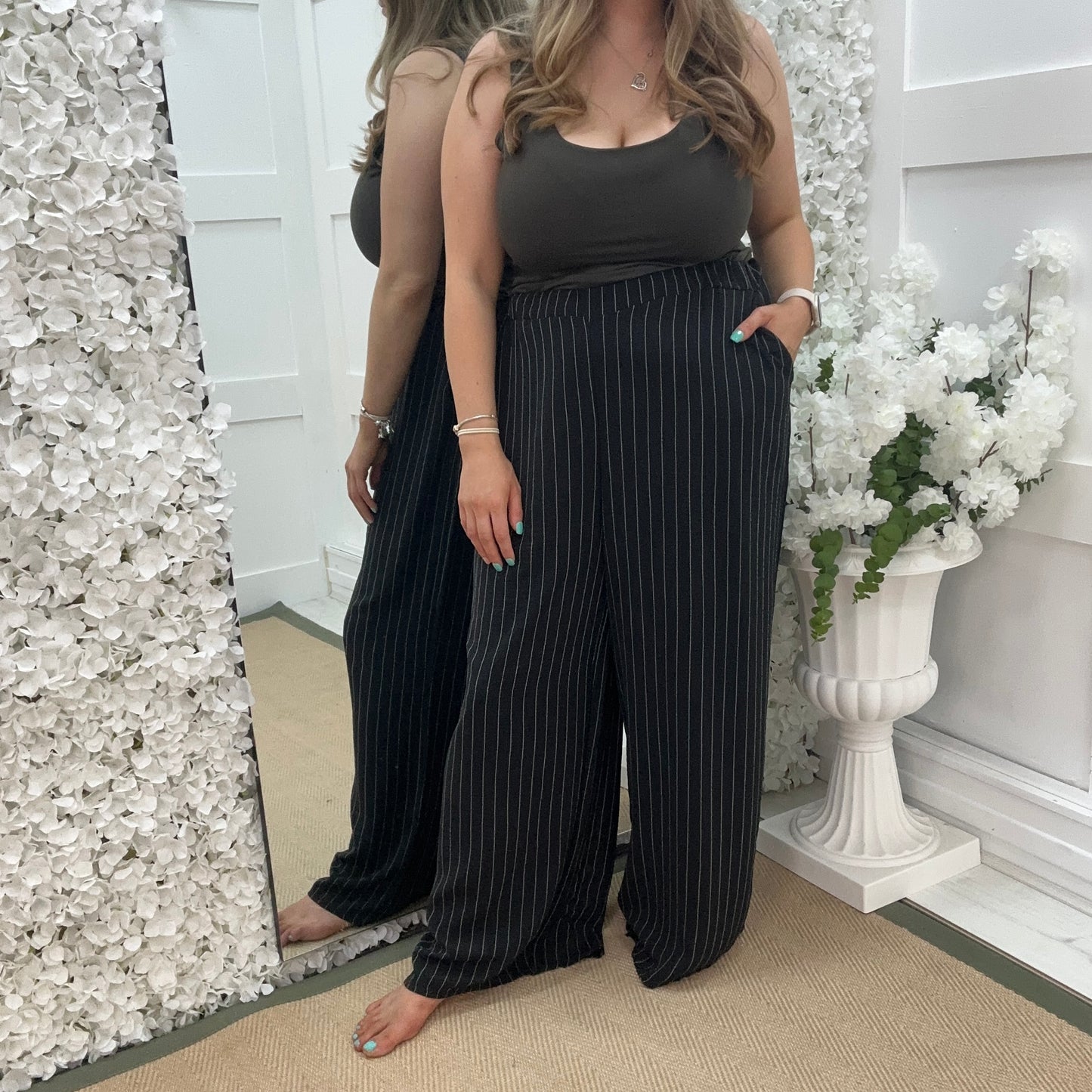 Storm: Black pinstripe wide leg trousers. One size: 16-22