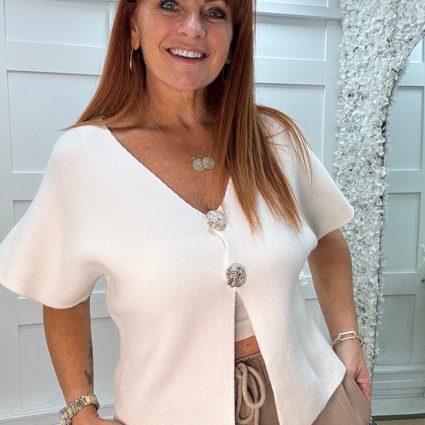 Sammi: White V neck gold button top. One size: 10-16