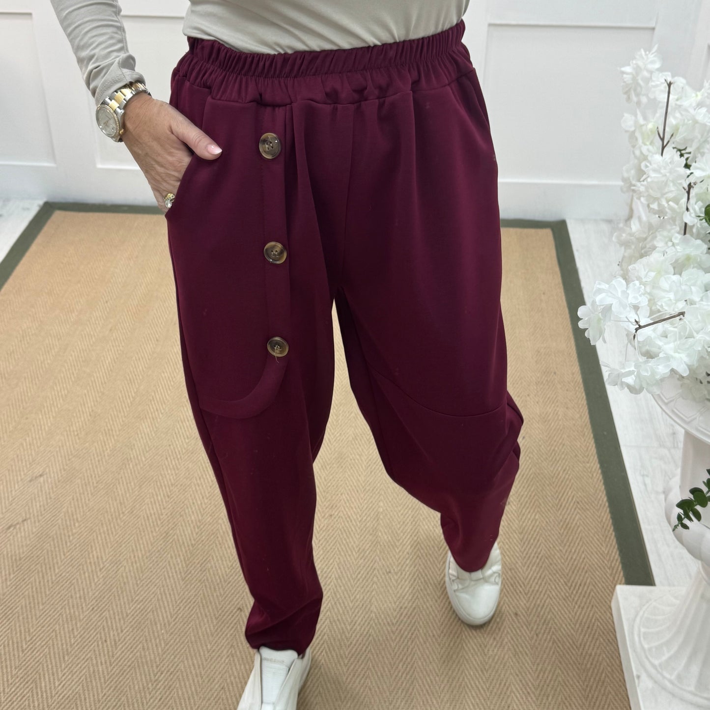 Monroe: Burgundy stretchy button trousers. One size: 12-18