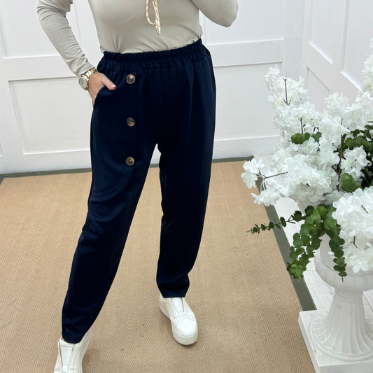 Monroe: Navy stretchy button trousers. One size: 12-18