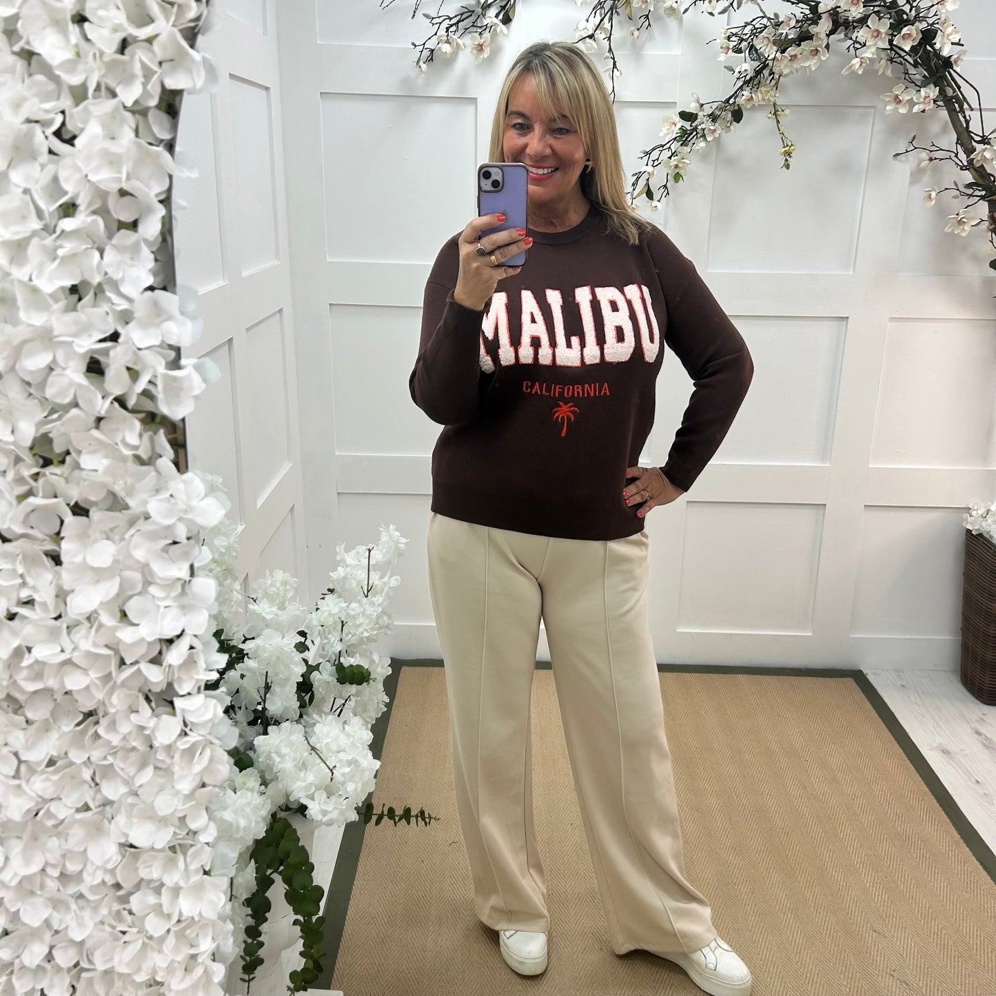 Melody: Brown textured MALIBU logo knitted top. One size 10-18