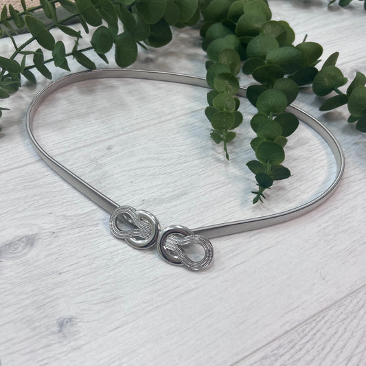 Mimi: Silver loop statement belt. One size: 8-18