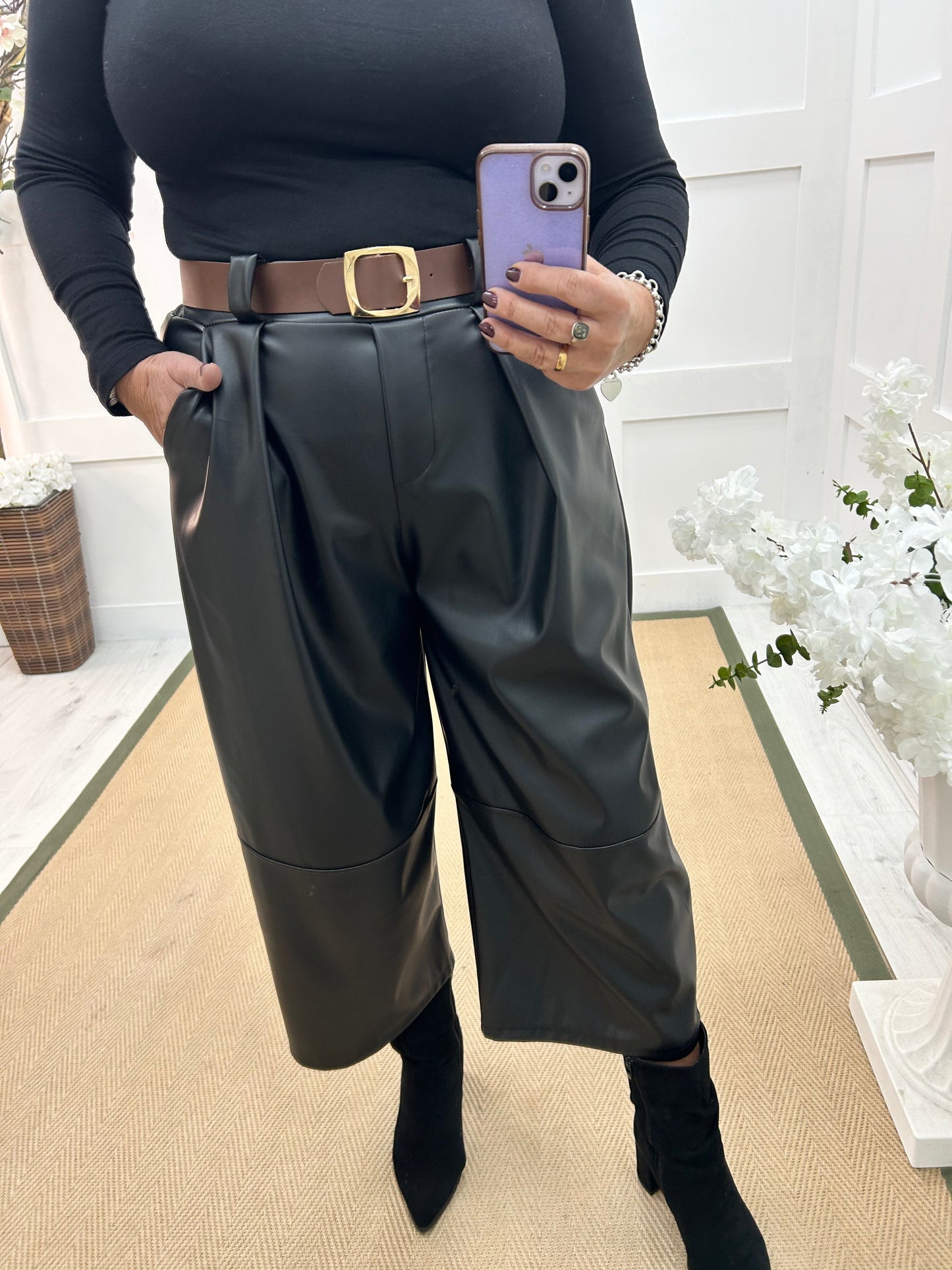 Allegra: Black 3/4 faux leather belted trousers. One size: 14-18