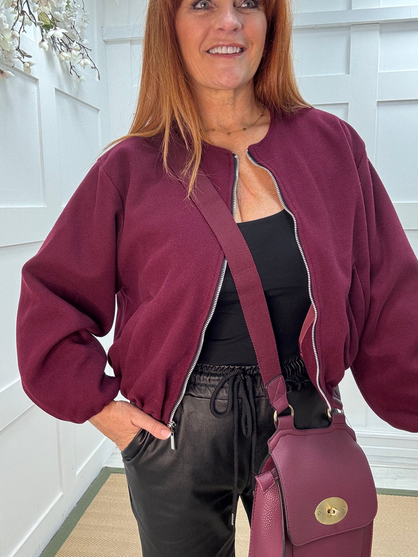 Jamiee: Burgundy soft feel bomber jacket. One size: 8-16