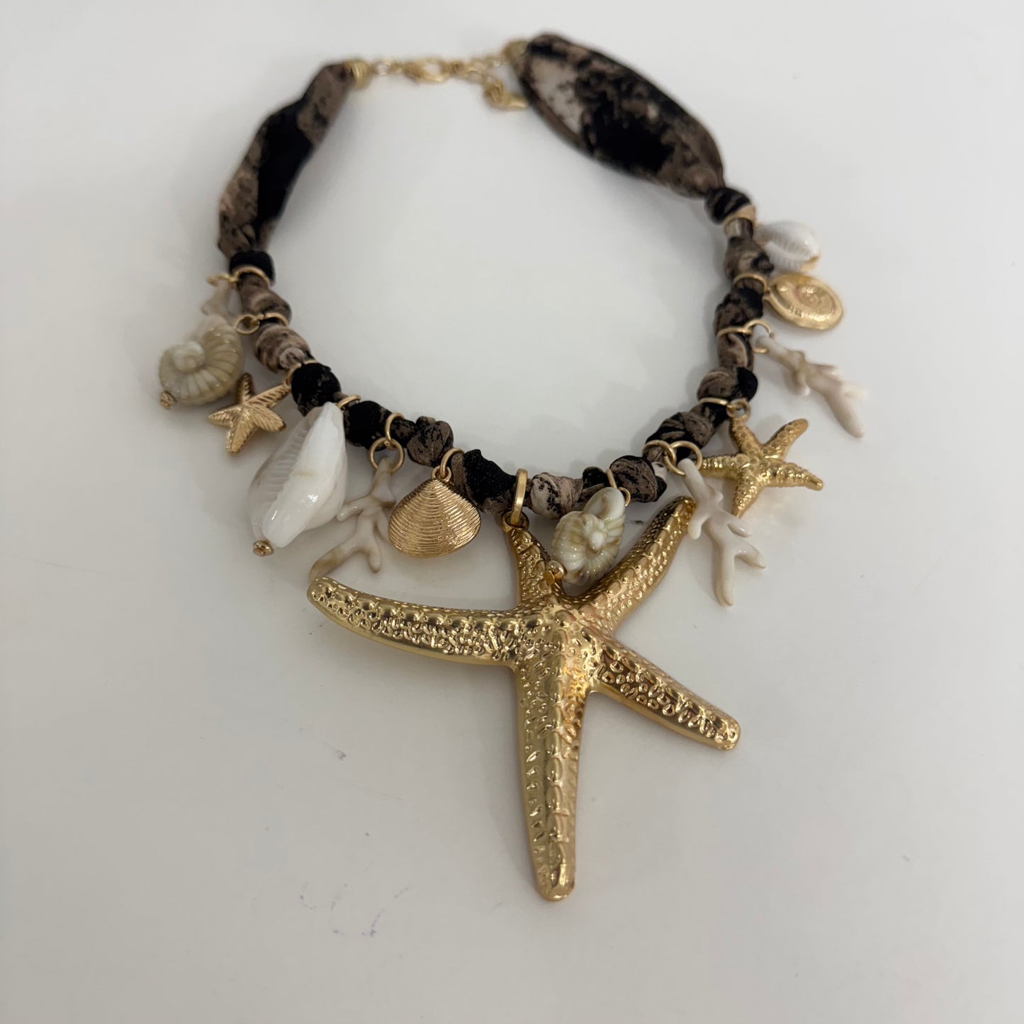 Tula: Fabric, gold starfish & shell necklace