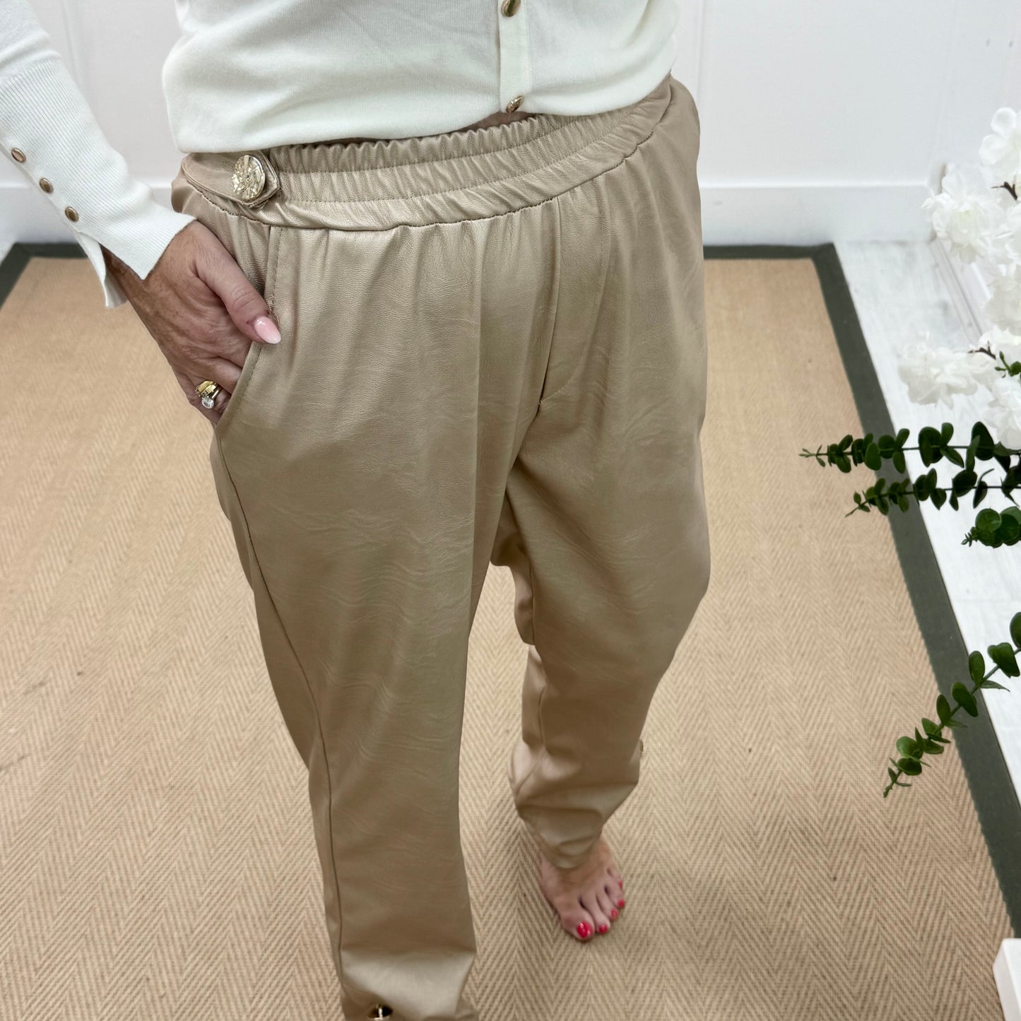 Tatum: Gold faux leather button trousers. One size: 14-18