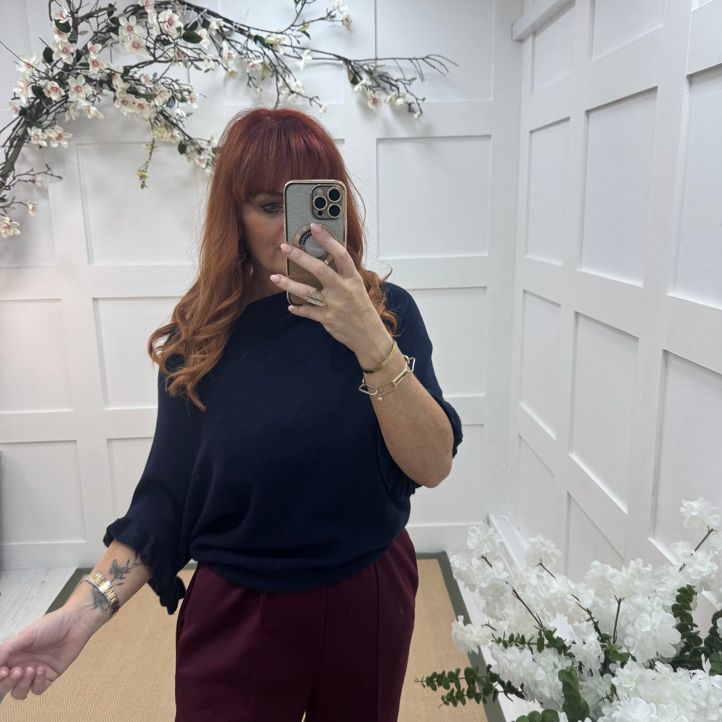 Sierra: Navy batwing fluted sleeve knitted top. One Size 12-18/20