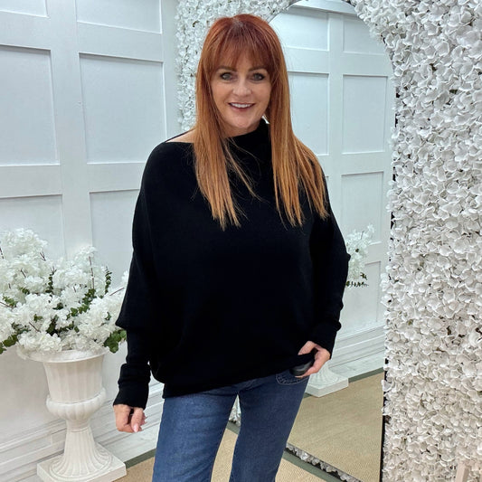 Erica: Black asymmetrical slouch soft knit top. One size 10-18