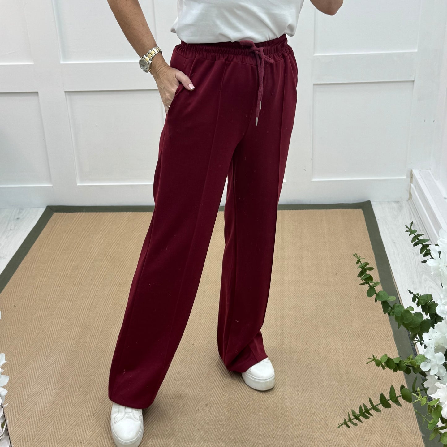 Trudy: Wine stretchy wide leg pocket trousers. 2 sizes