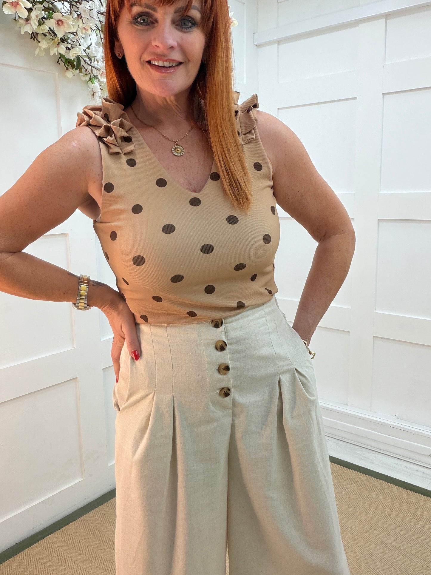 Tiara: Cream cropped wide leg buttoned front trousers. 4 sizes