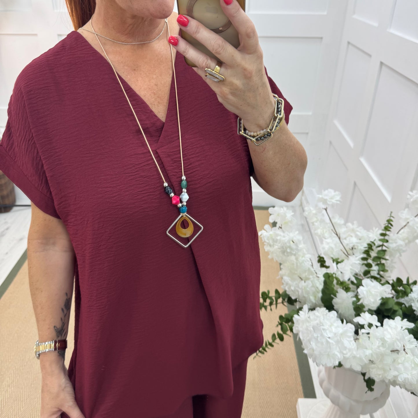 Eliza: Burgundy V neck top & pendant. One size: 14-20