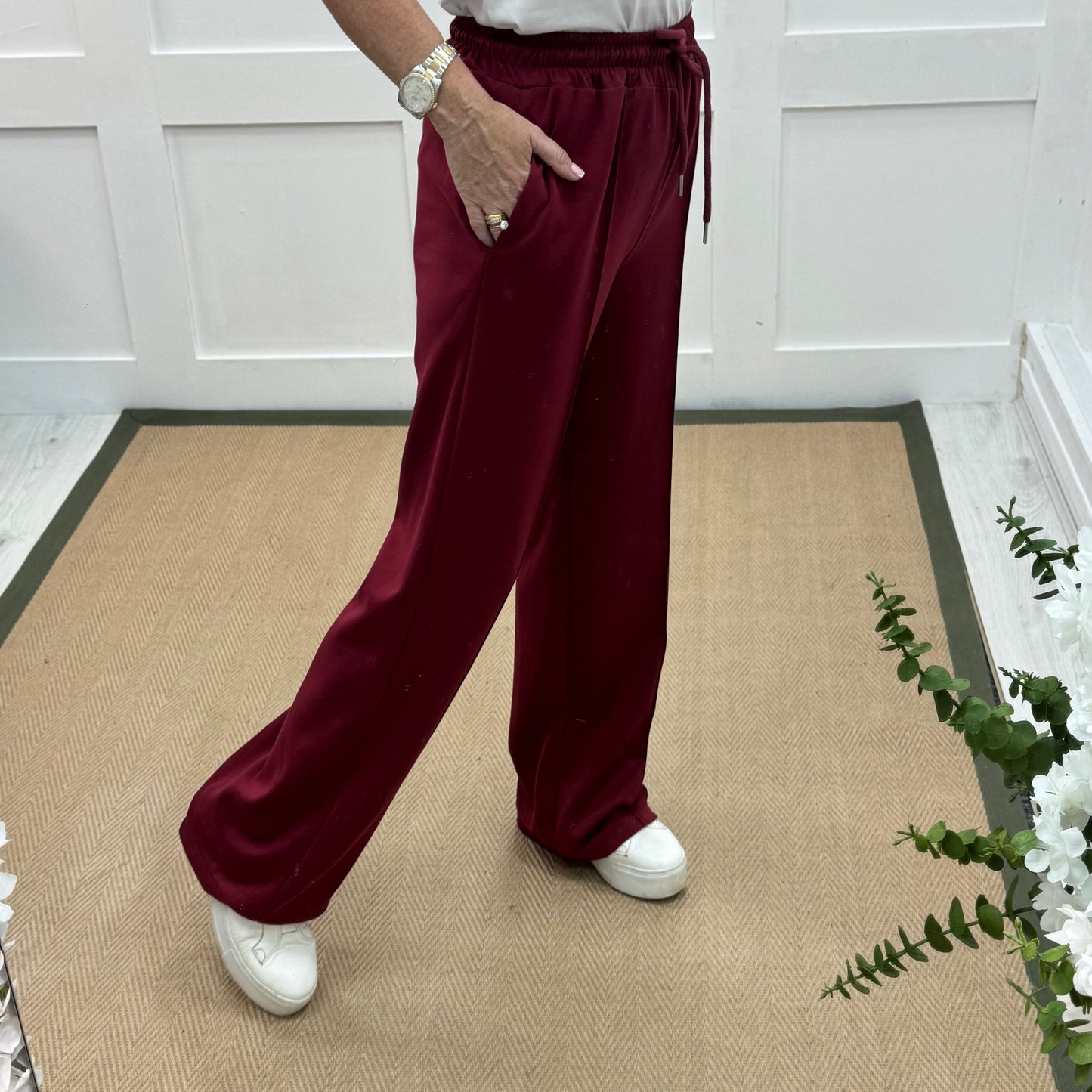 Trudy: Wine stretchy wide leg pocket trousers. 2 sizes