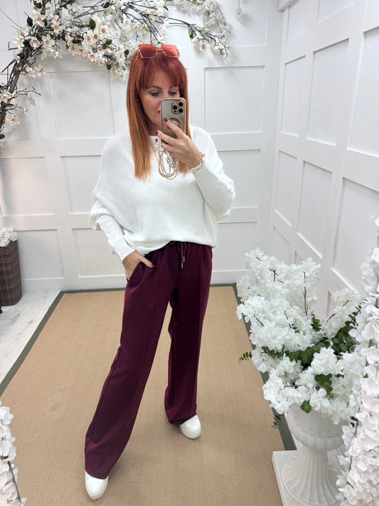 Trudy: Burgundy stretchy wide leg pocket trousers. 2 sizes