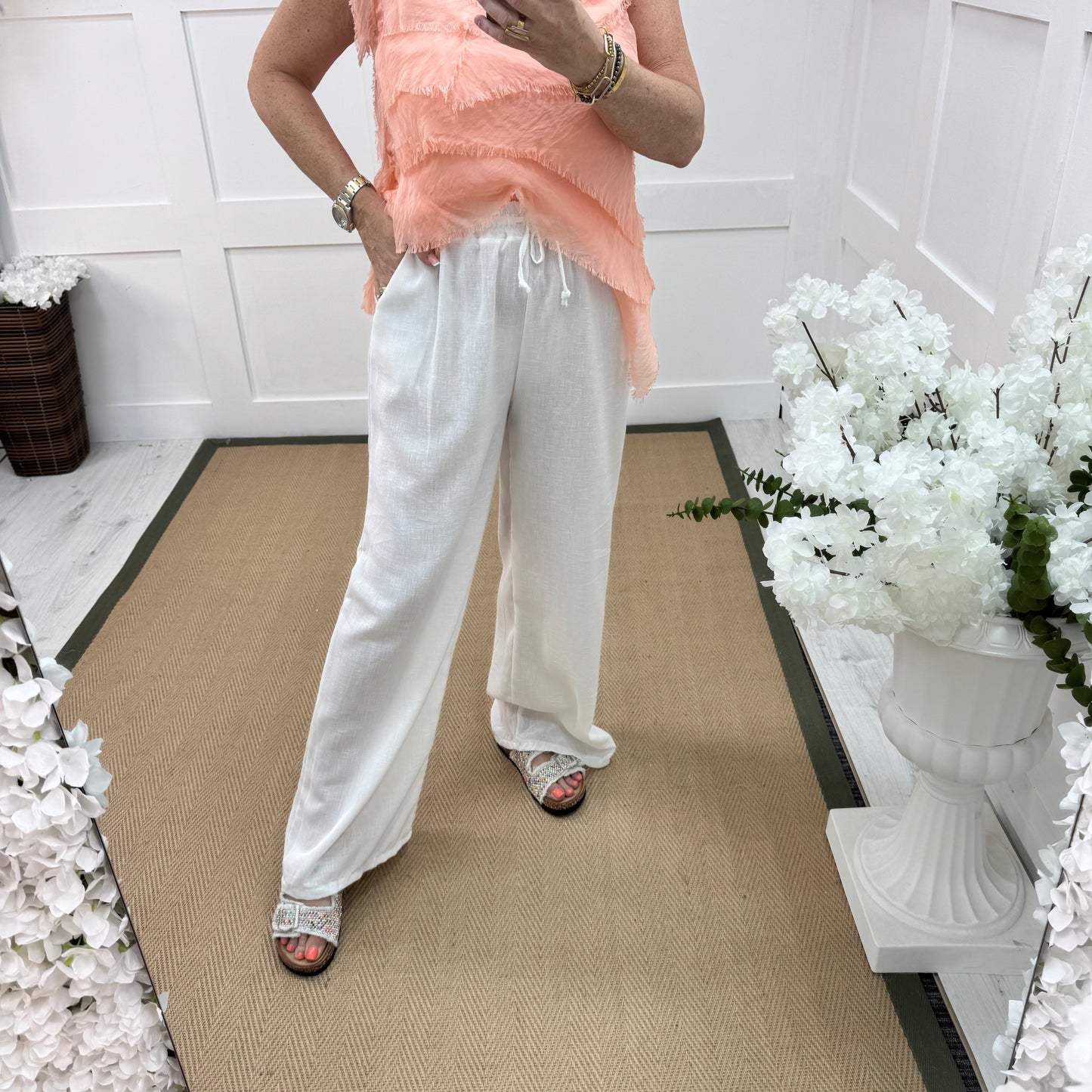 Leanne: White wide leg trousers. One size: 10-16