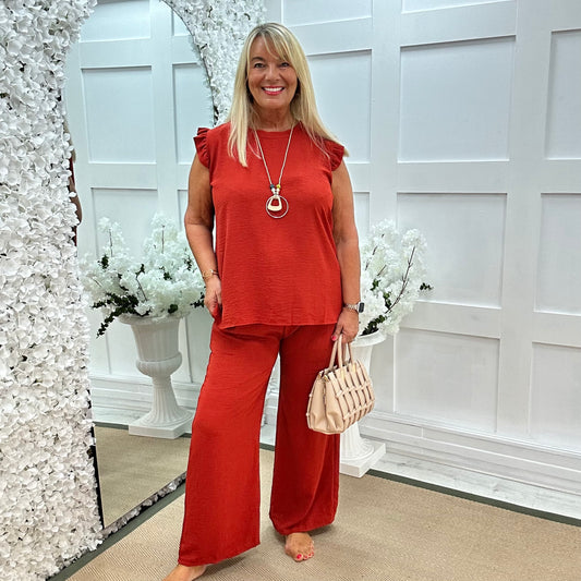 Esme: Orange pocket wide leg trousers. One size: 12-20