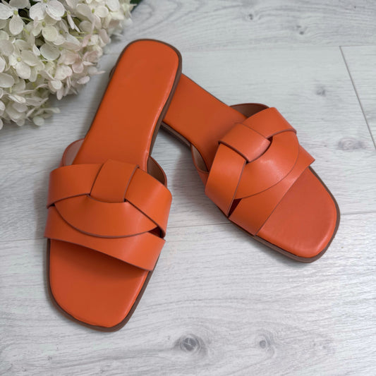 Sallie: Orange weaved sliders. Sizes: 3-8