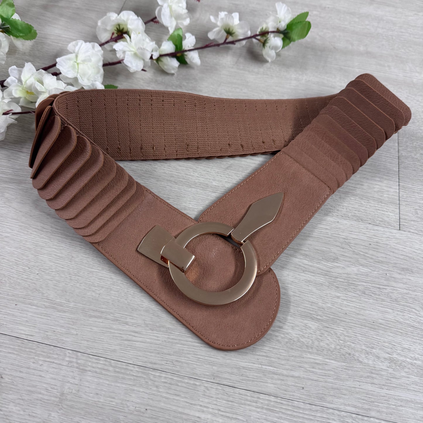 Rina: Stretchy belt with large buckle. One Size 10-18