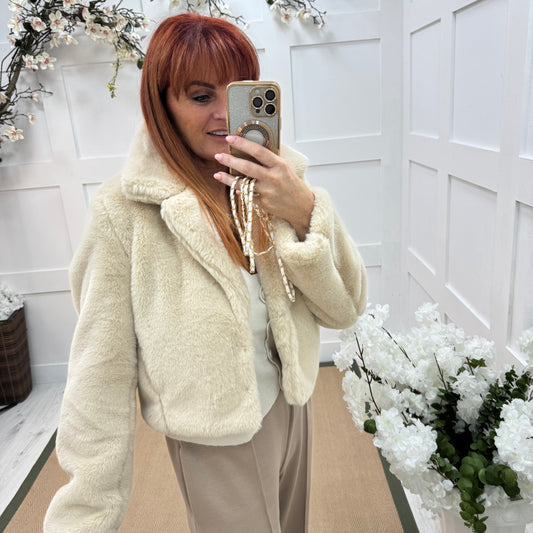 Paula: Cream short faux fur jacket . One size 10-16