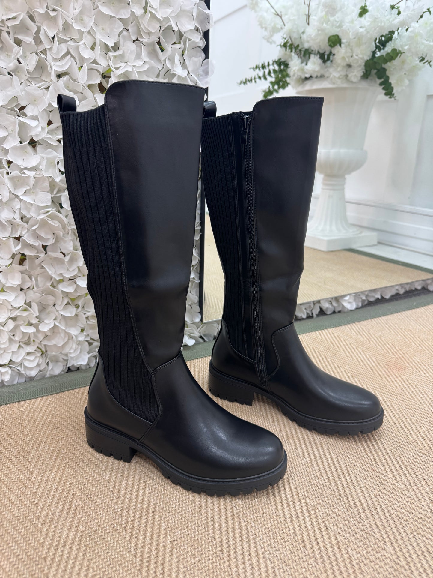 Trova Black stretchy knee high boots. Sizes: 3-8