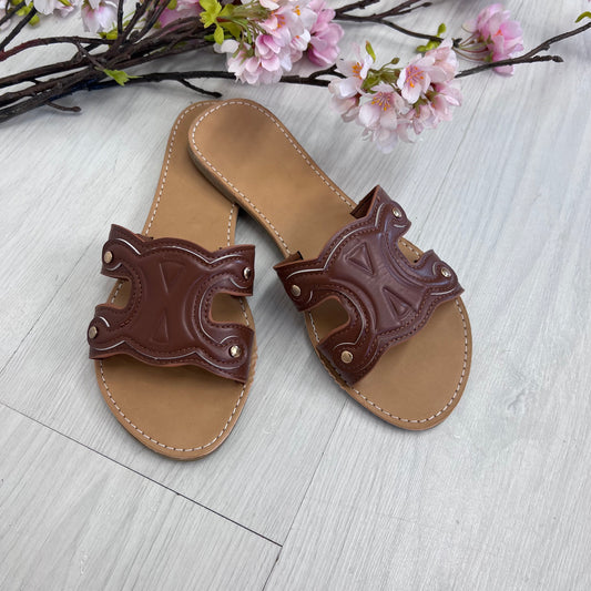 Lucia: Tan cut out style sliders. Sizes: 4-9