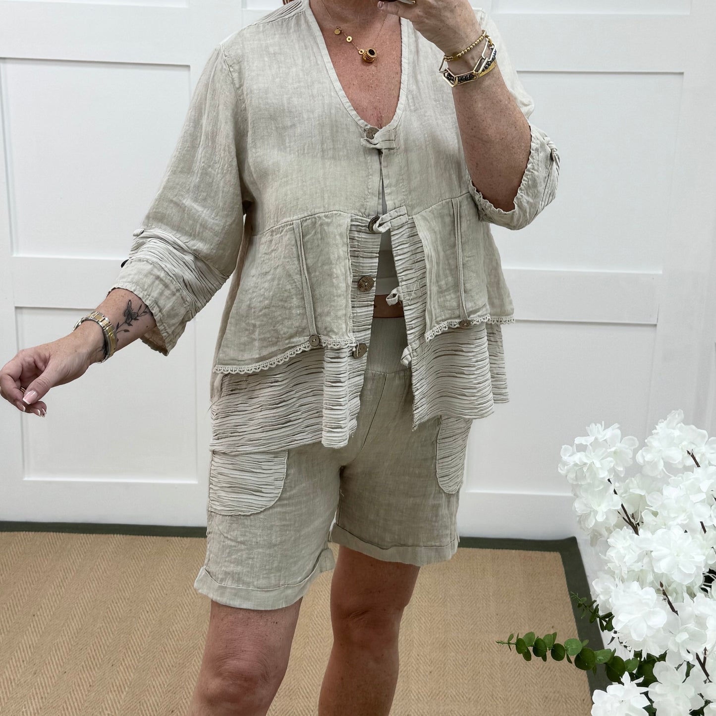 Brogan: Cream Made in Italy linen shorts. Sizes: 12-18
