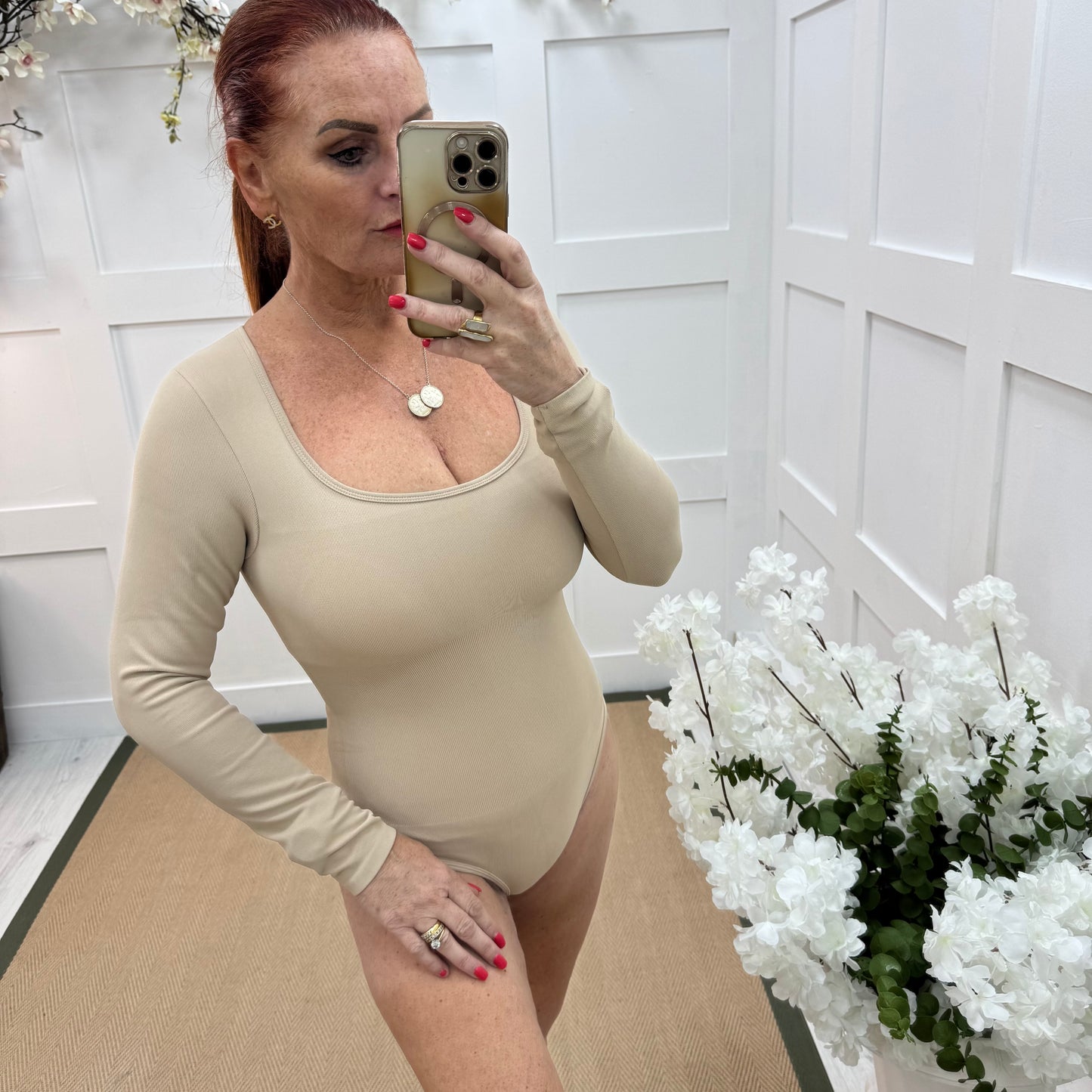 April: Sand stretchy waist cinch bodysuit. 2 sizes