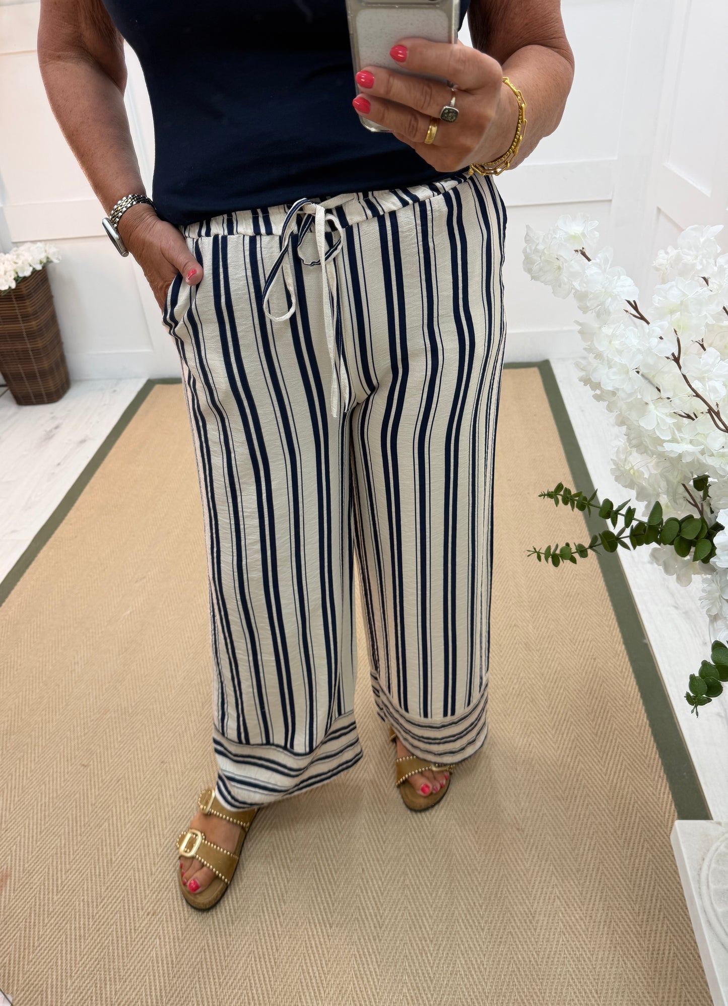 Stella: Cream & navy wide leg stripe trousers. One size: 10-16