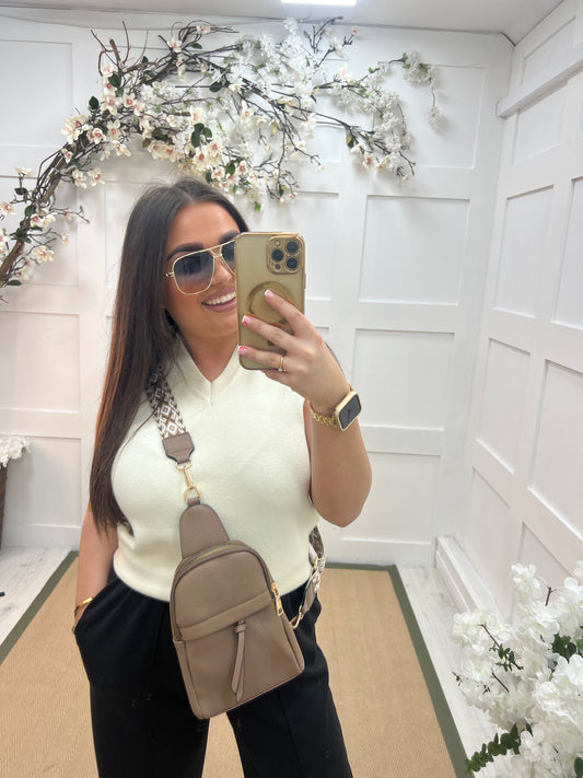 Tara: Cream V neck tank top. One size: 10-14