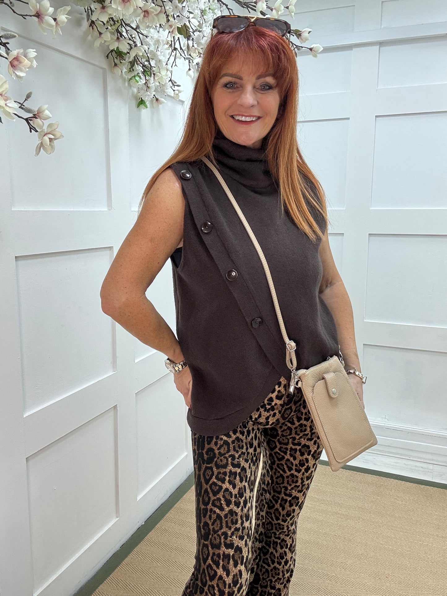 Viola: Brown sleeveless cowl neck wrap top. One Sz: 10-16